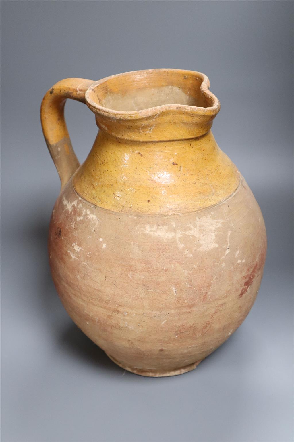 A Verwood earthenware jug, height 34cm